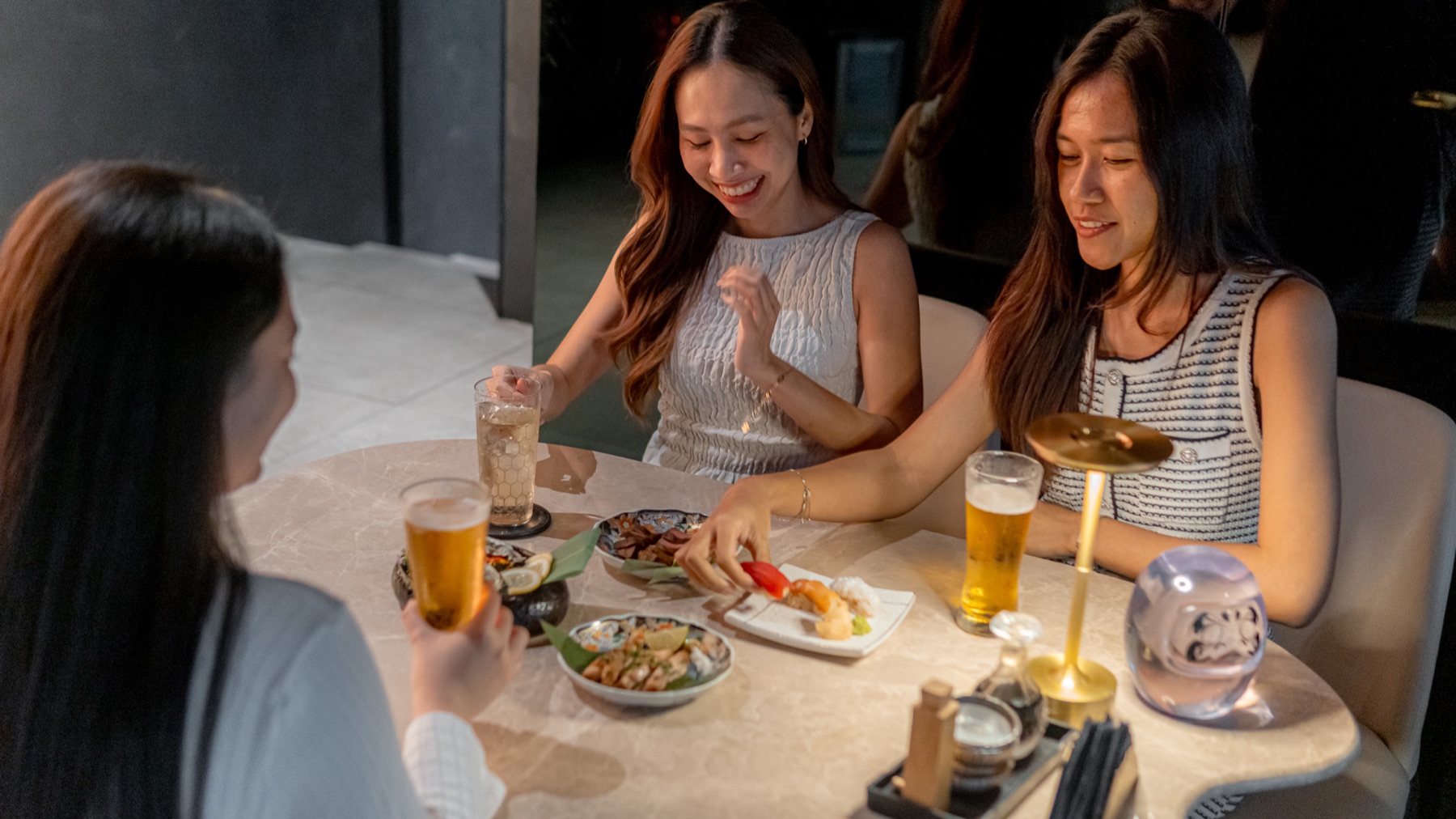 Friends enjoying after-work food and drinks at TEPPEN Ekkamai