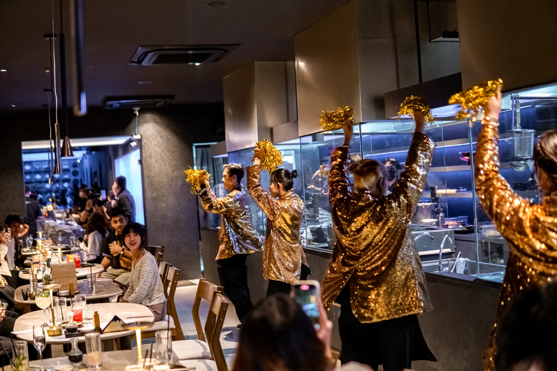 Cast performance and guest reactions during a full-store celebration at TEPPEN Ekkamai