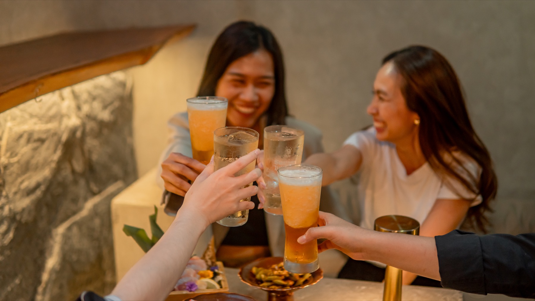Friends enjoying an after-work dinner at TEPPEN Sathorn